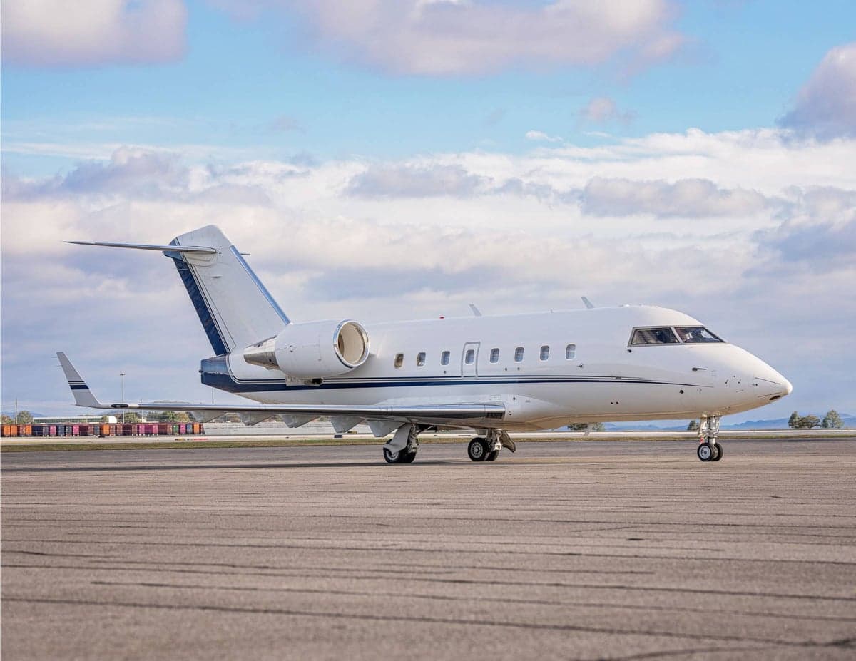 Side view of a Challenger aircraft on the tarmac.