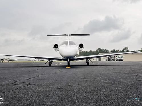 Front view of a Cessna Citation CJ1+ aircraft on the ground.