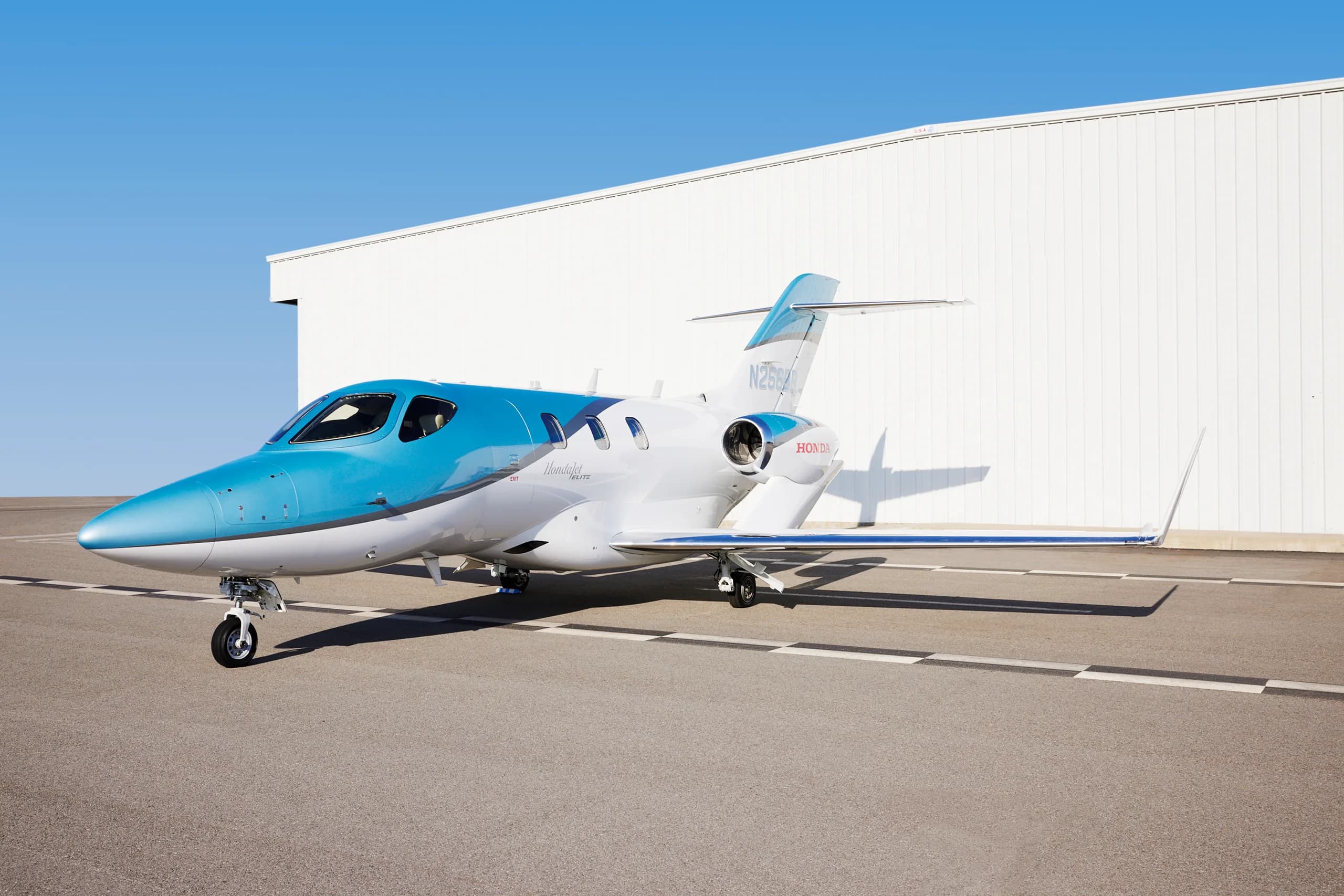 Side view of a HondaJet Elite with registration N256BB.
