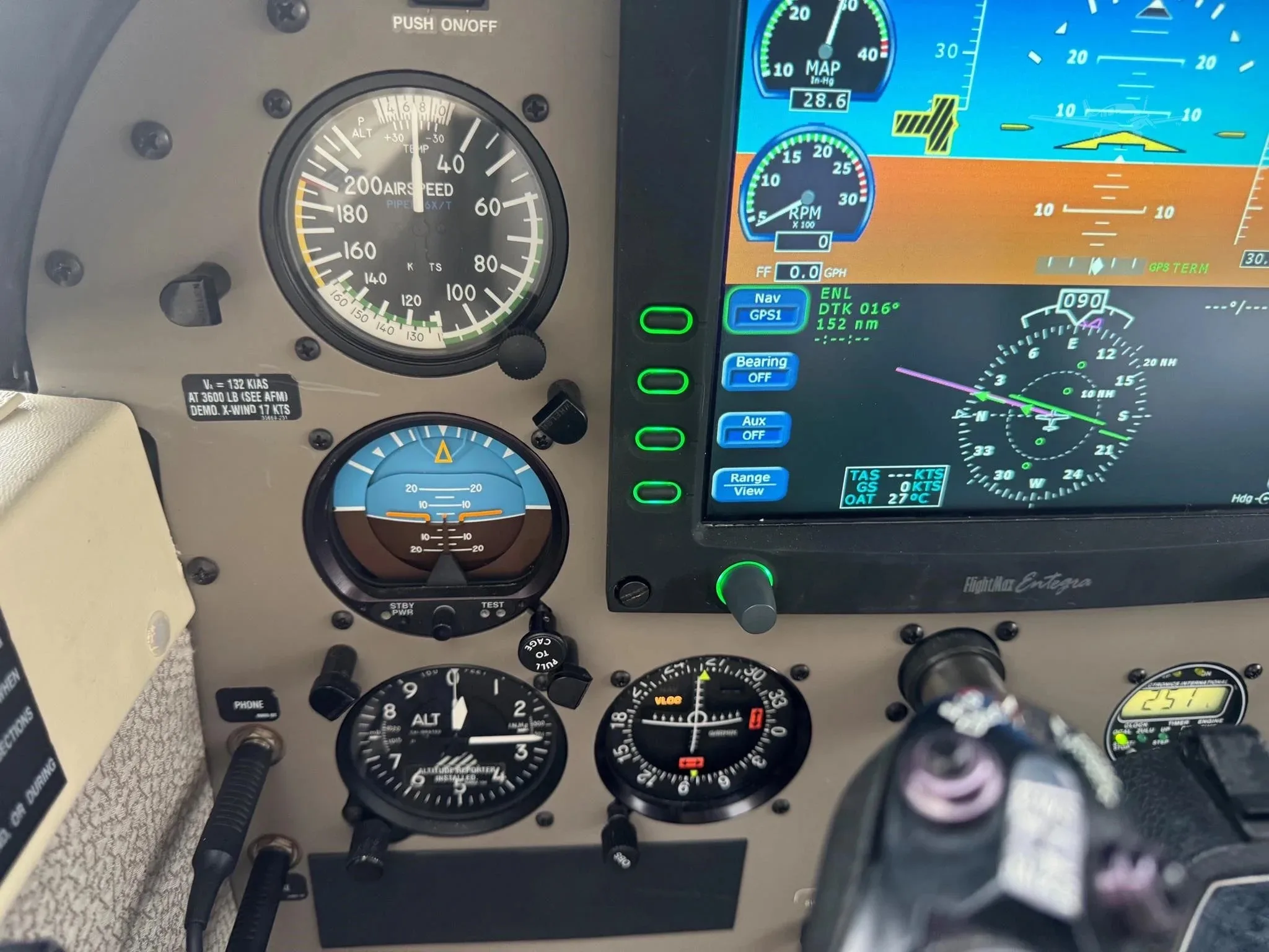 A close-up of the left side of the Piper Malibu Mirage N3094W's instrument panel, showing traditional gauges and a glass display.