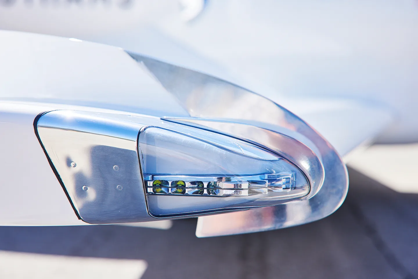 Close up of the tail light of a white HondaJet.