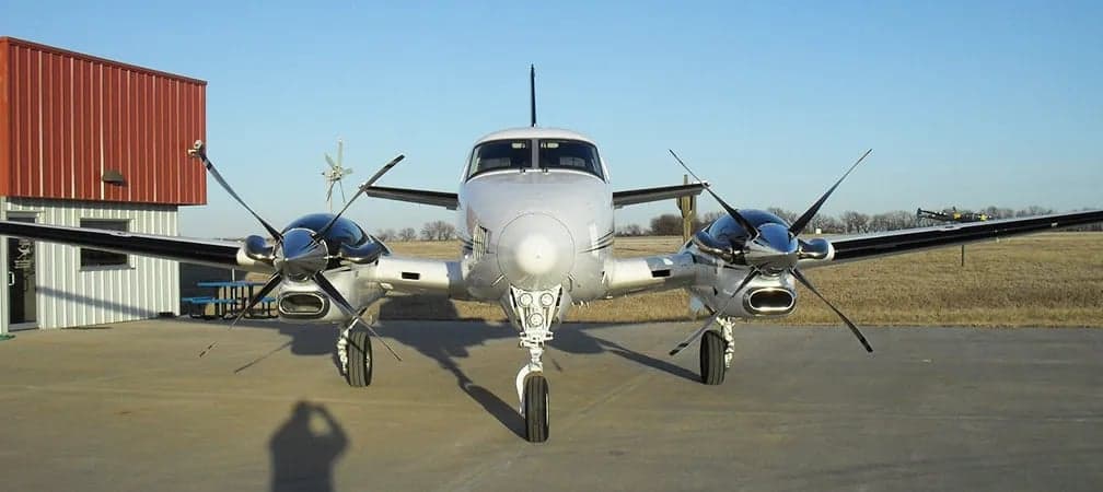 Front view of a Beechcraft King Air on the ground.