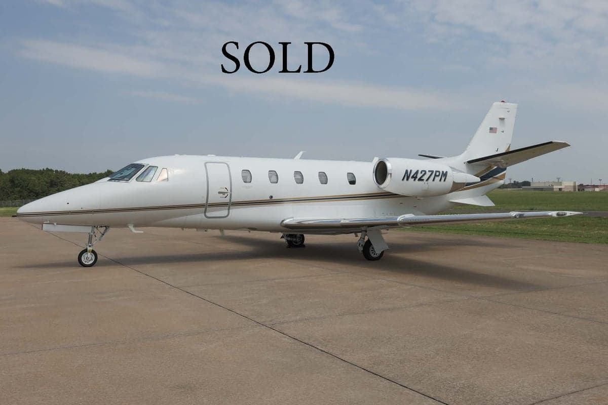 A Citation XLS+ aircraft with registration N427PM is parked on the tarmac with a SOLD overlay.