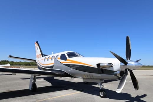 Front side view of the aircraft on the tarmac.