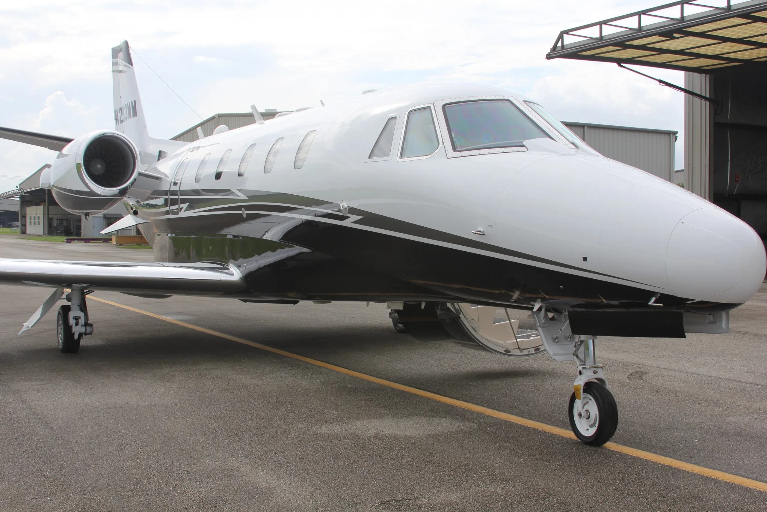 Front quarter view of the N283MM aircraft on the tarmac.