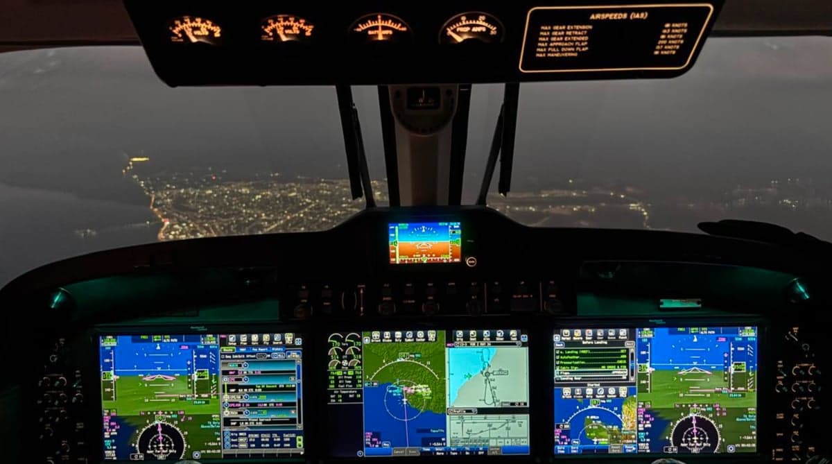 View of the King Air 250 cockpit at night.