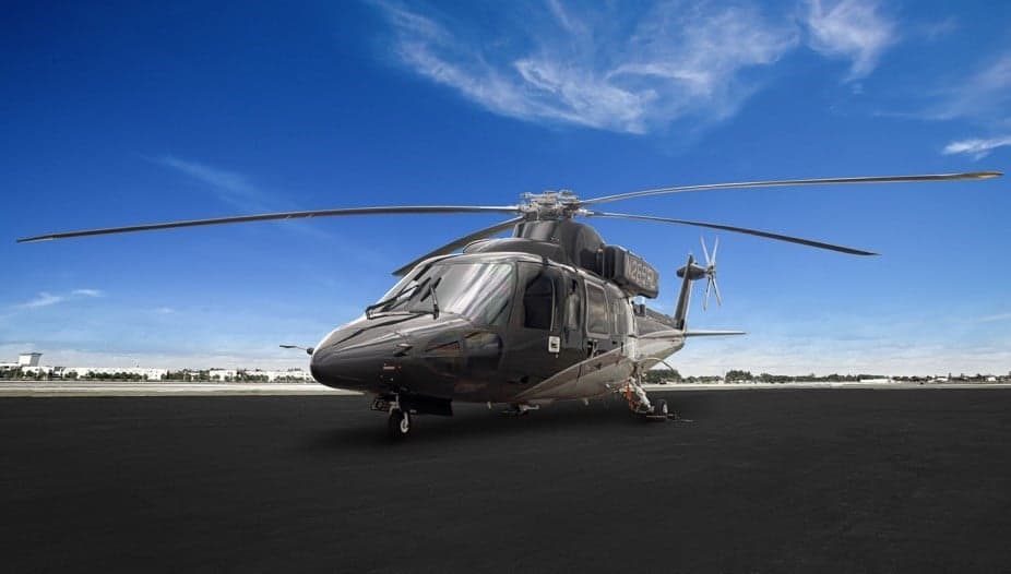 Front quarter view of a gray and silver AgustaWestland AW139 helicopter on the tarmac.