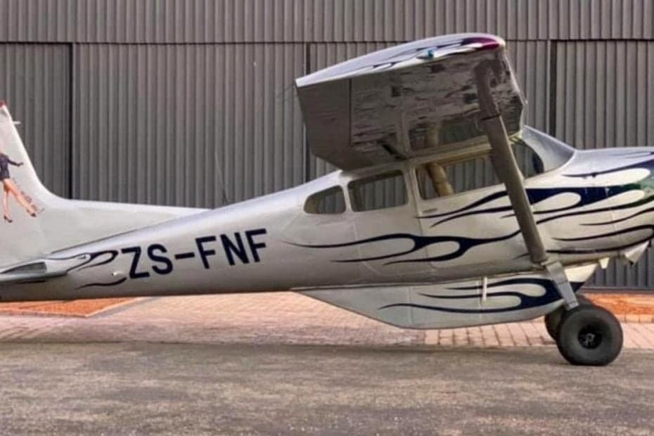 A Cessna 206 with a custom flame paint job.