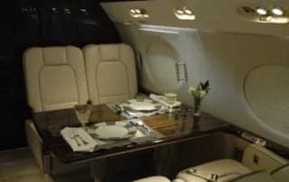 A dining table set for two in the aircraft interior.