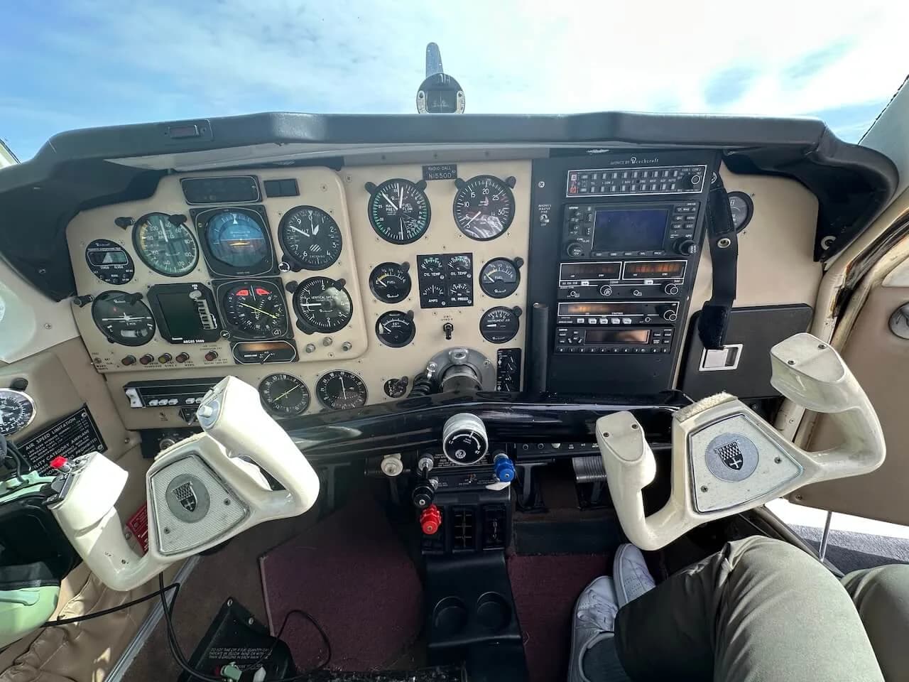 View of the aircraft's instrument panel and control yokes.
