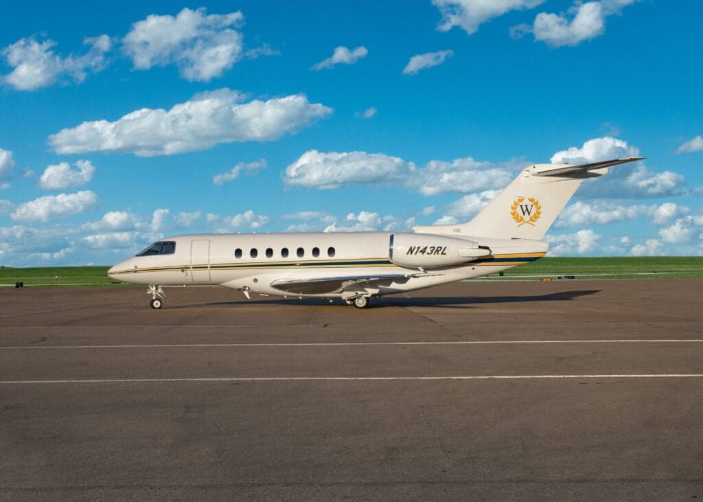 Close up of the engine and fuselage of a private jet.