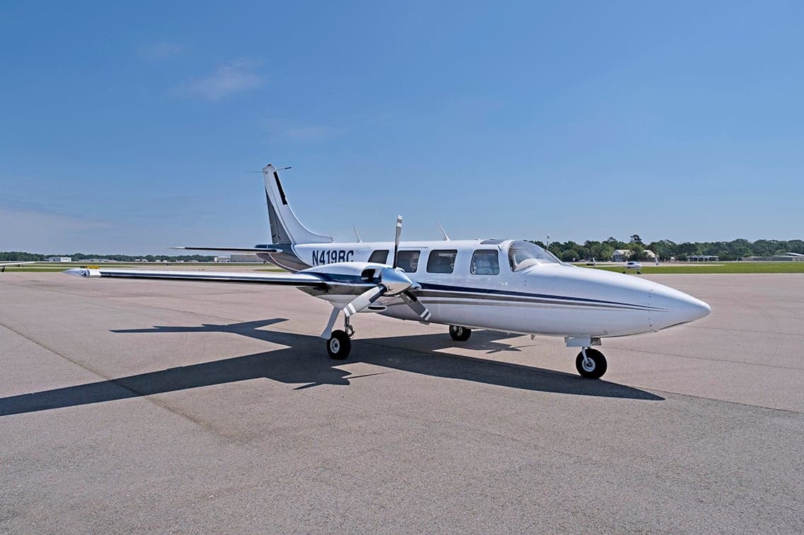 Aerostar aircraft N419BC parked on the tarmac with a white and gray paint scheme.