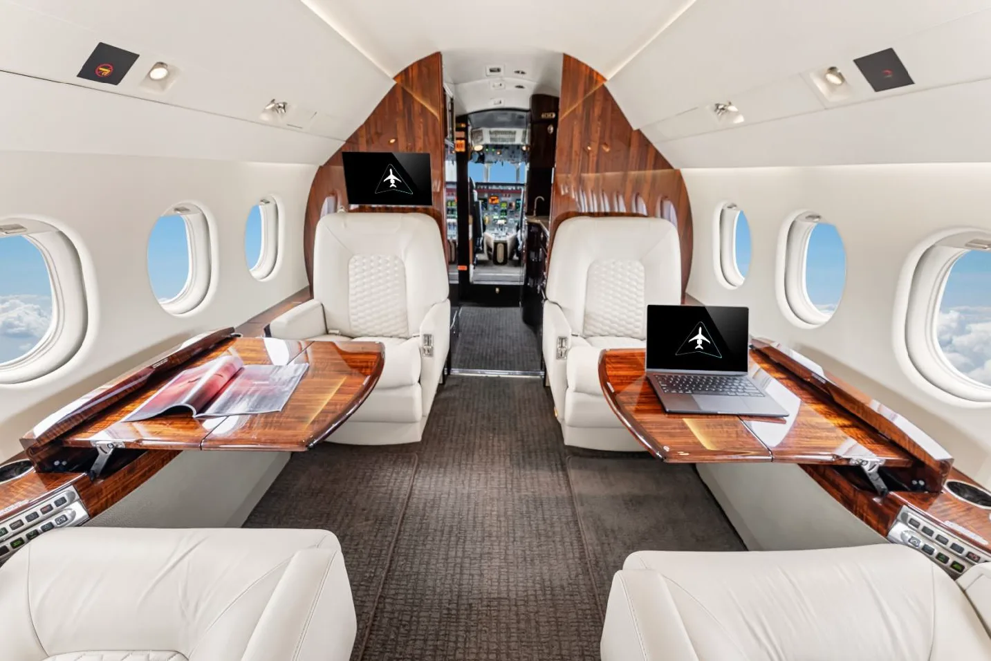 Interior of the aircraft with white leather seats and wood trim.