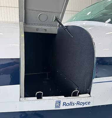Open baggage compartment on a Beechcraft Bonanza.