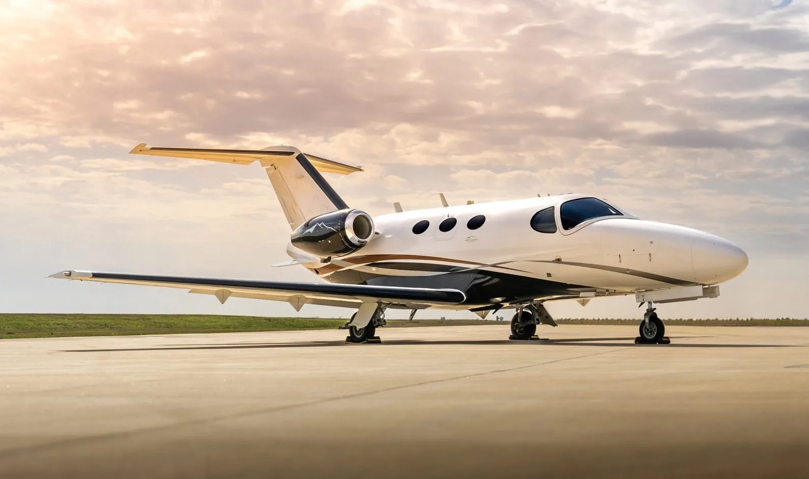 Side view of a Beechcraft Premier 1A aircraft on the tarmac.