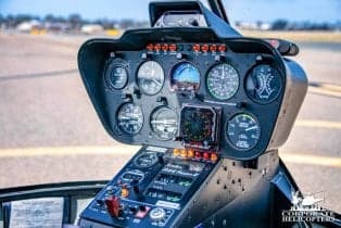 Close-up of the cockpit instrument panel of the Robinson R44 helicopter.