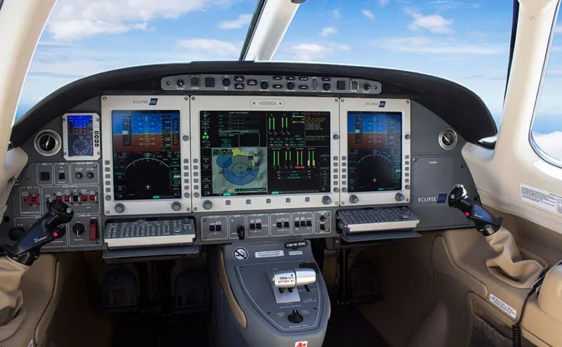 The cockpit of an Eclipse 550 jet, showing the instrument panel and controls.
