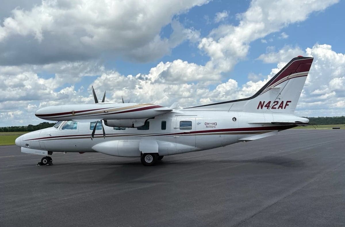 Side view of the aircraft N42AF on the tarmac.
