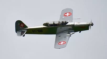 Potez 58 aircraft taking off from a wet runway.