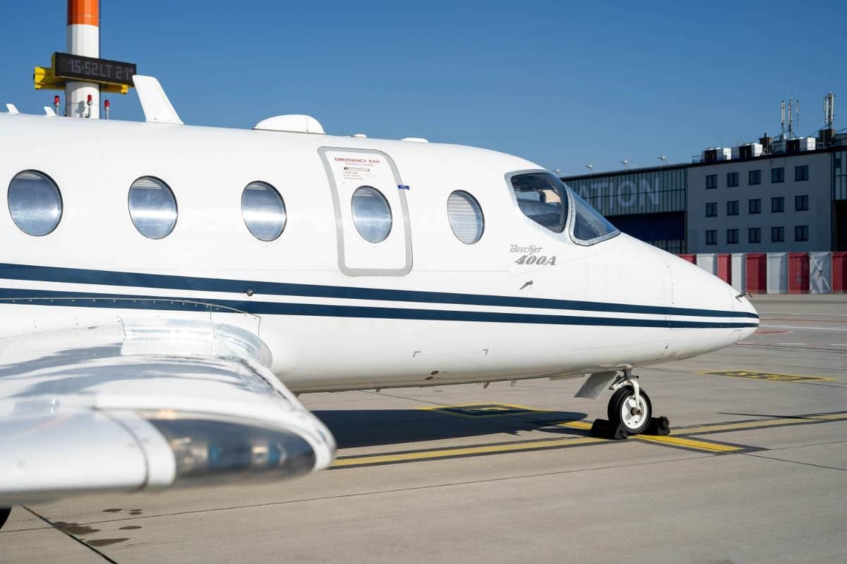 Close-up of the Beechcraft Beechjet 400A aircraft's nose and fuselage.