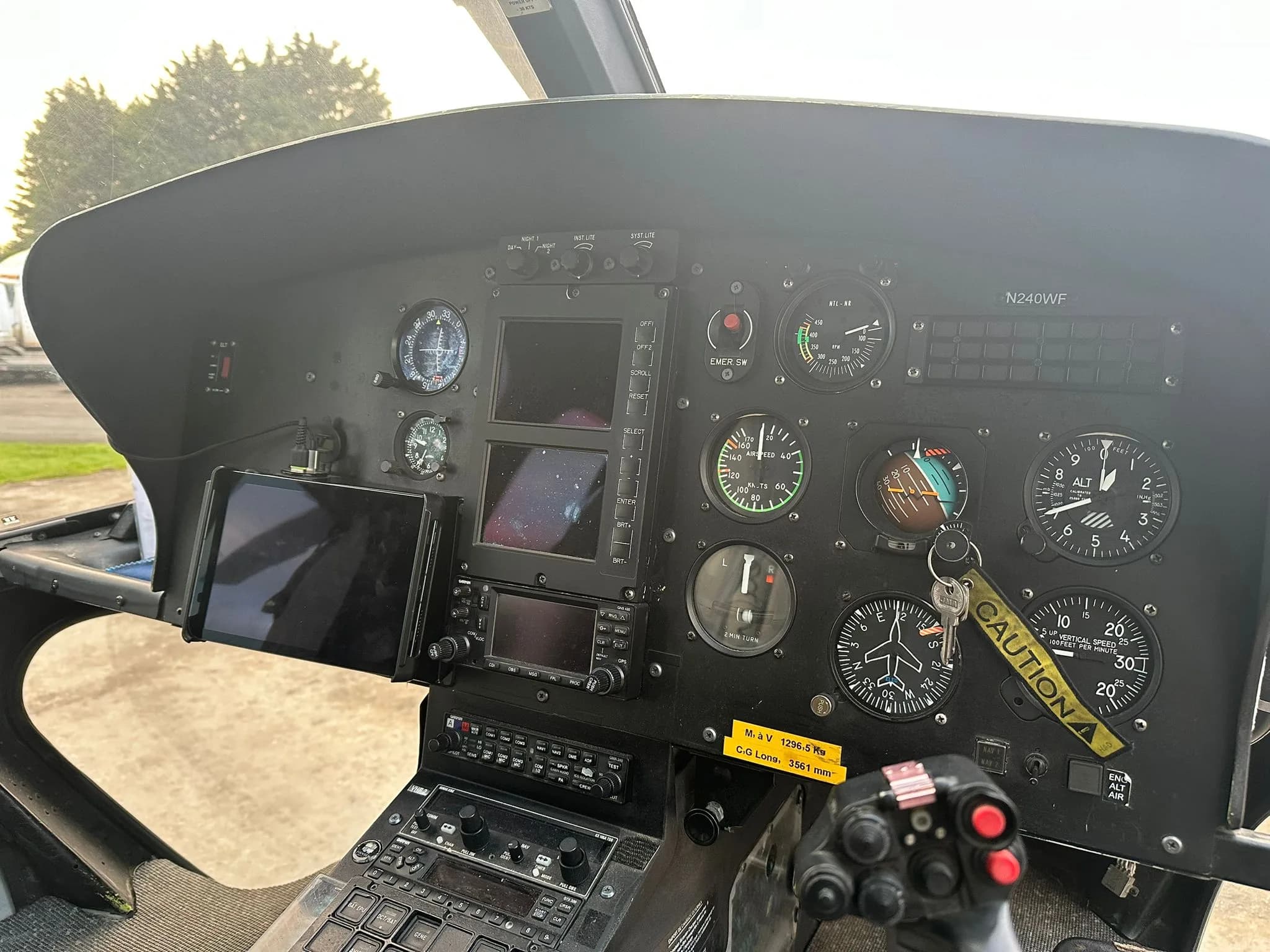Close-up of the helicopter's instrument panel with various gauges and displays.