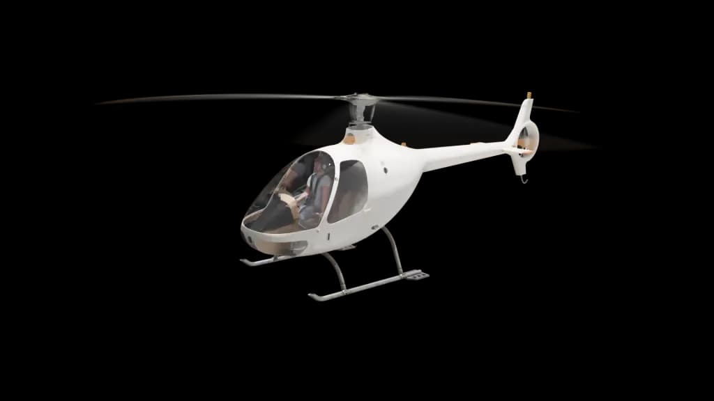 A white helicopter with orange-tipped rotor blades is shown in a slightly different flight angle against a plain background.
