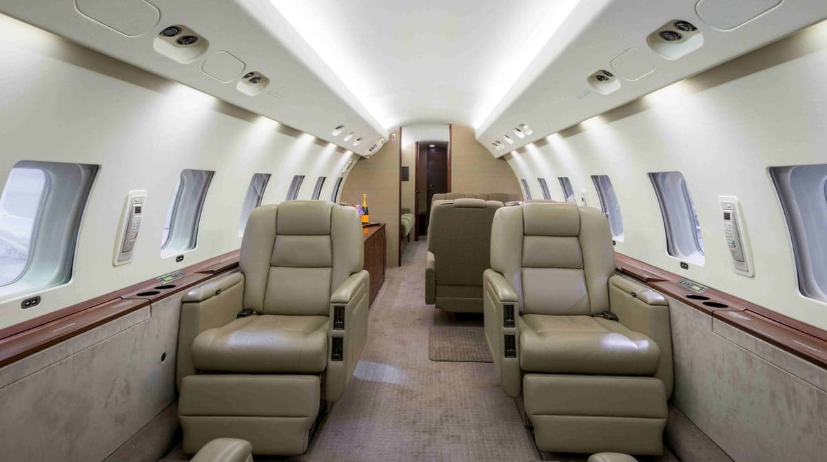 Interior view of the aircraft cabin with leather seats.