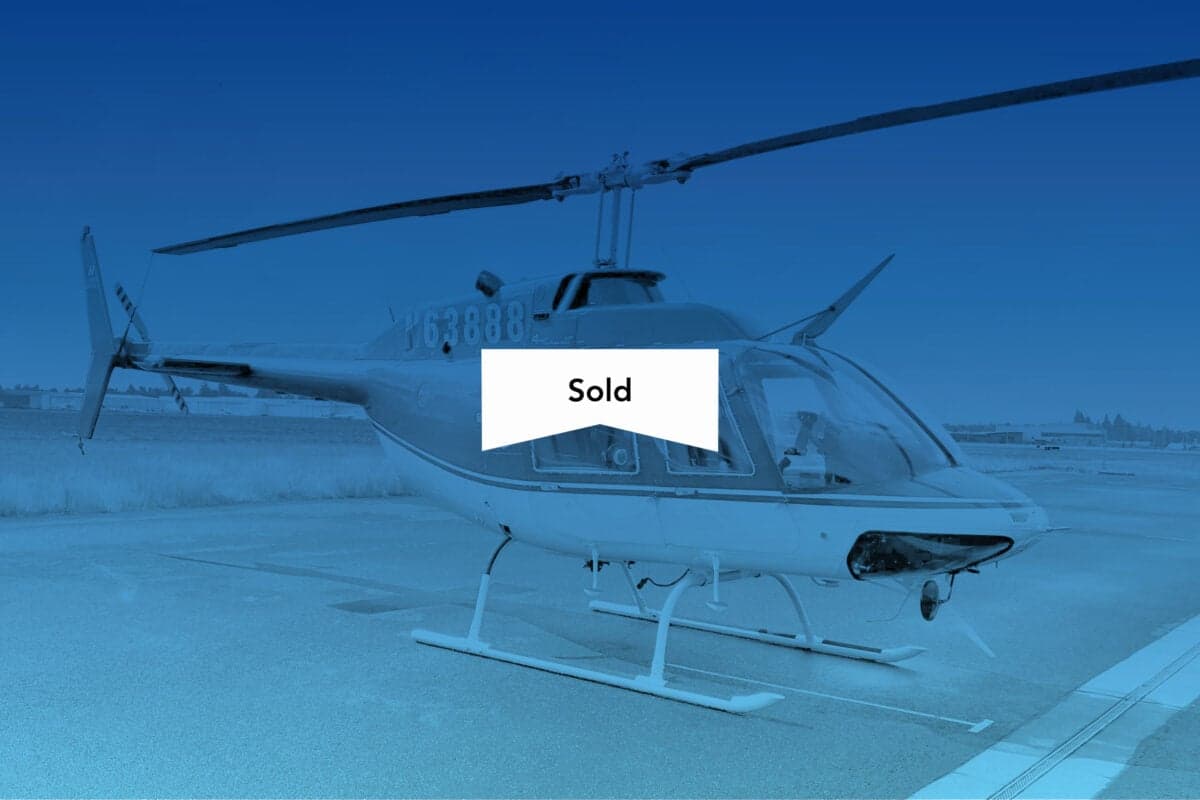 N63888 helicopter on the tarmac with a SOLD banner overlayed.