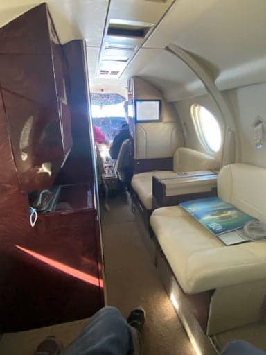 View of the aircraft cabin with a refreshment center.