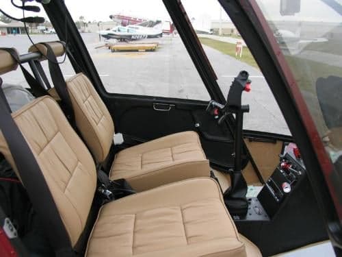 View of the front seats and controls inside the helicopter.