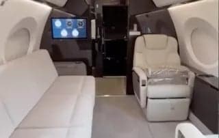 View of the cabin with a couch and single seat.