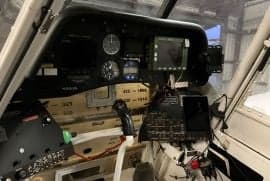 View of the instrument panel inside the cockpit of an aircraft.