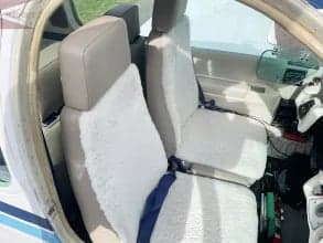View of the cockpit seats and instrument panel.