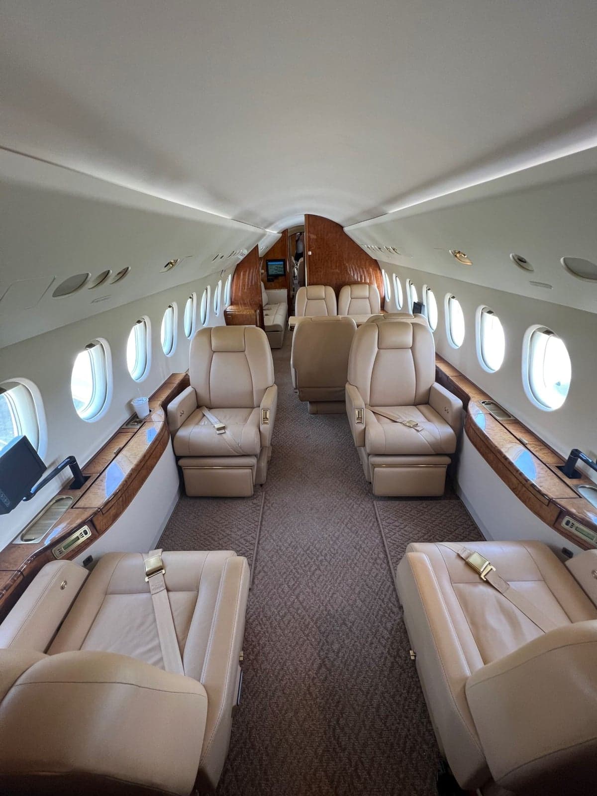 Interior of the aircraft showing seats and a side console.