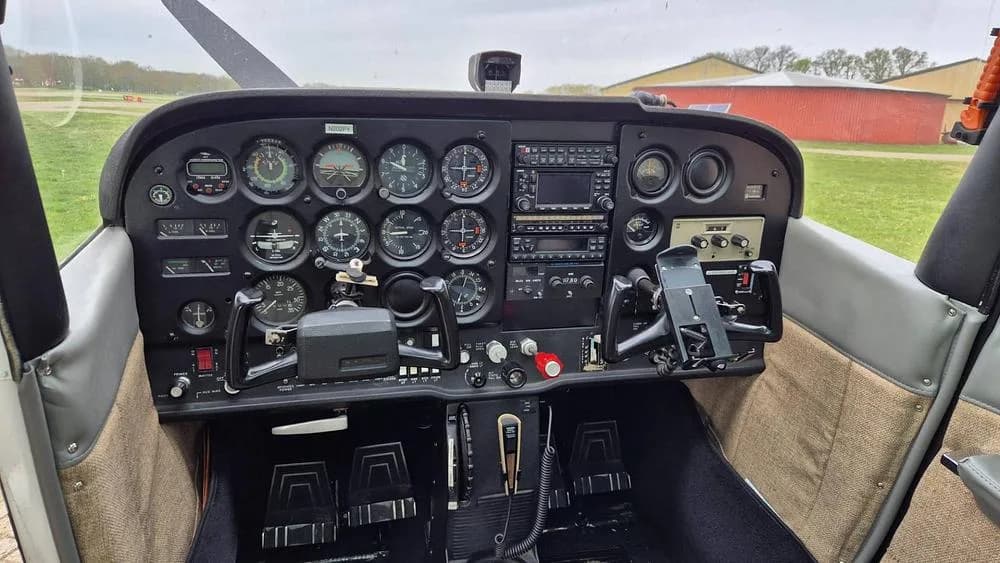 The instrument panel of a Cessna Skyhawk II, featuring analog gauges and avionics.