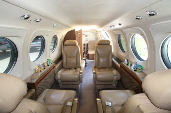 Interior view of the Beechcraft King Air 200 cabin with leather seats.