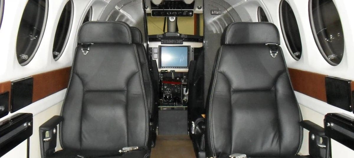 Aircraft cabin interior with leather seats.