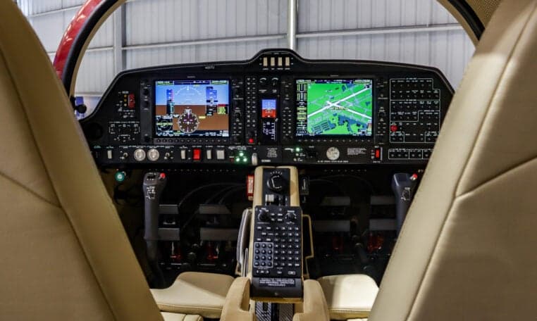 View of the Diamond DA62 cockpit from the passenger seats.