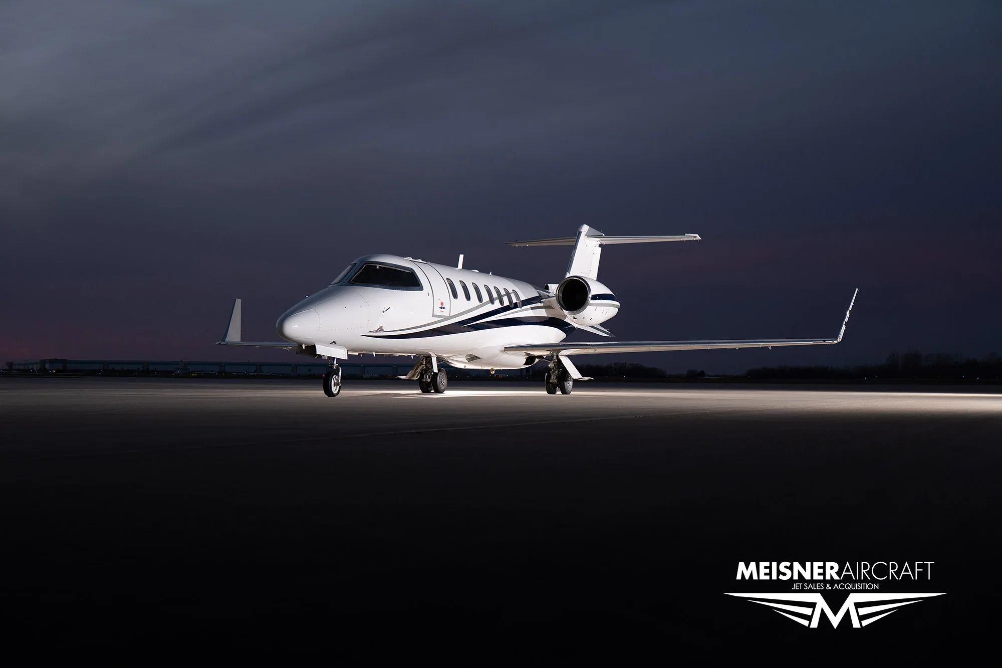 Learjet 45XR N289NX on the tarmac at dusk.