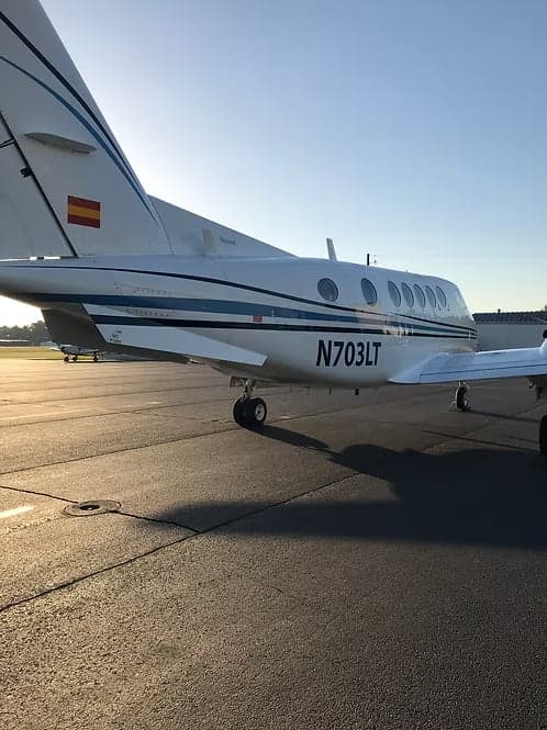The tail of a King Air with registration N703LT.