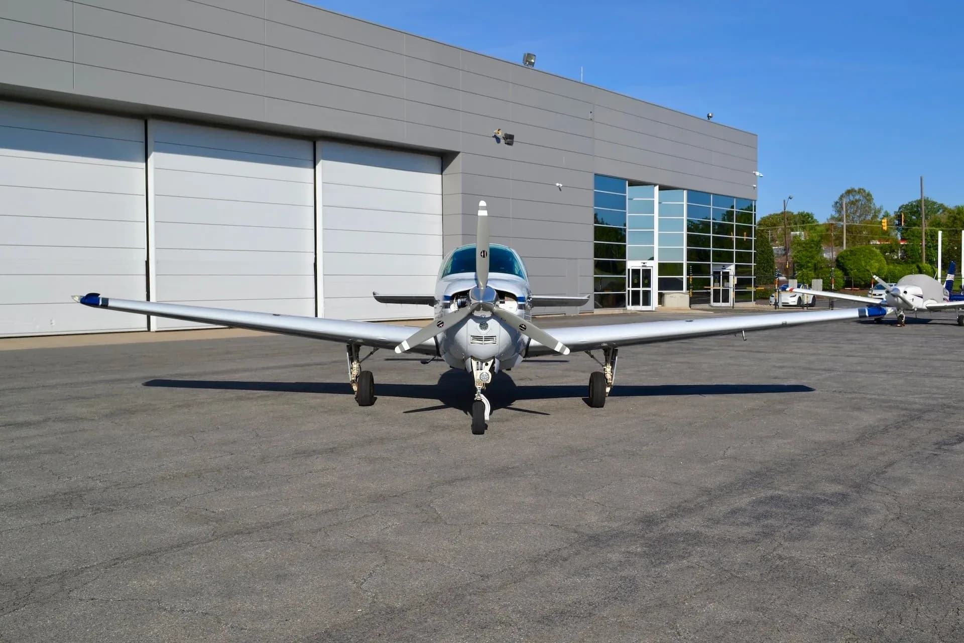 Front view of the Beechcraft Bonanza N8142W parked on the tarmac.