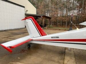 The tail of a white and red aircraft with the registration number N688WA.
