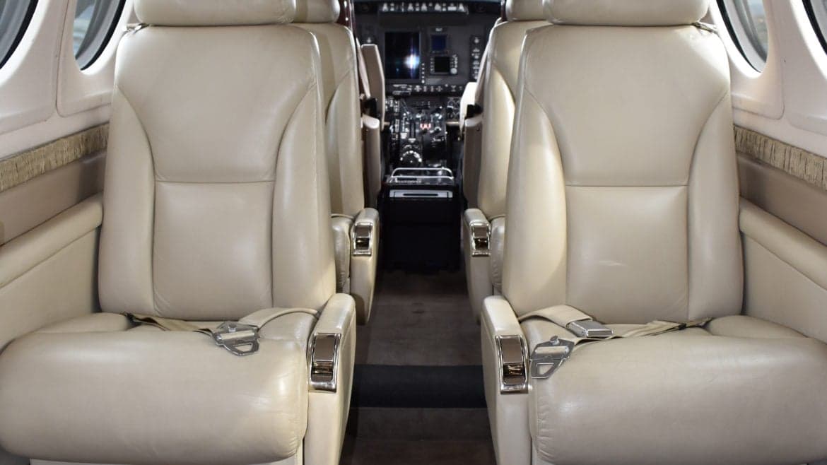 A view of the King Air cabin seats facing the cockpit.