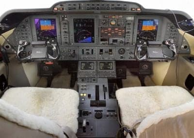 The cockpit of the Citation CJ3+ features dual flight displays and sheepskin seat covers.