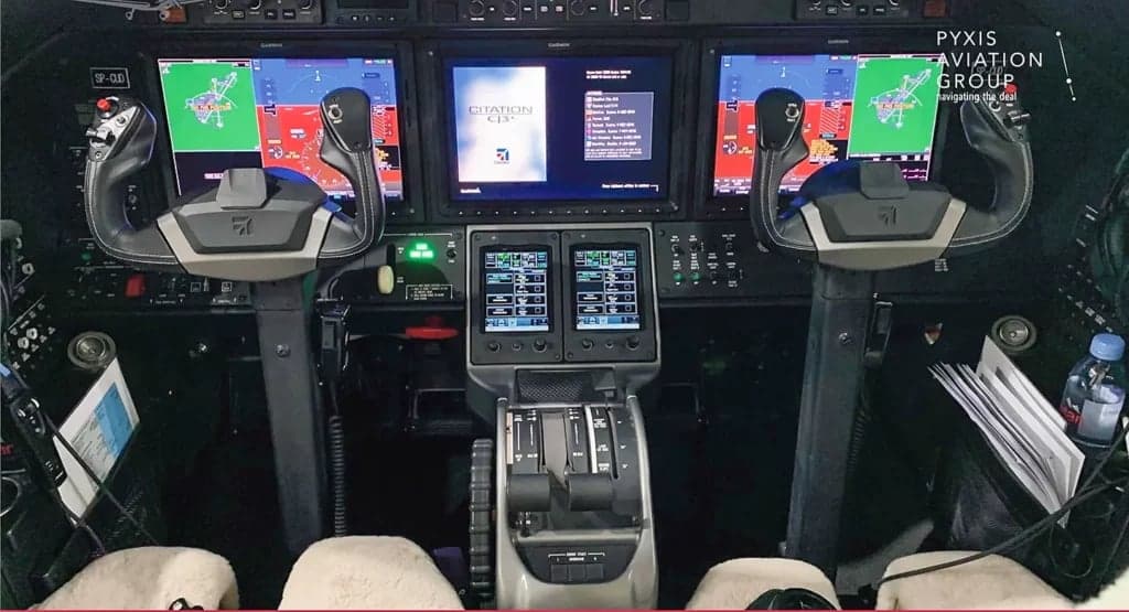 The cockpit features modern avionics and controls.