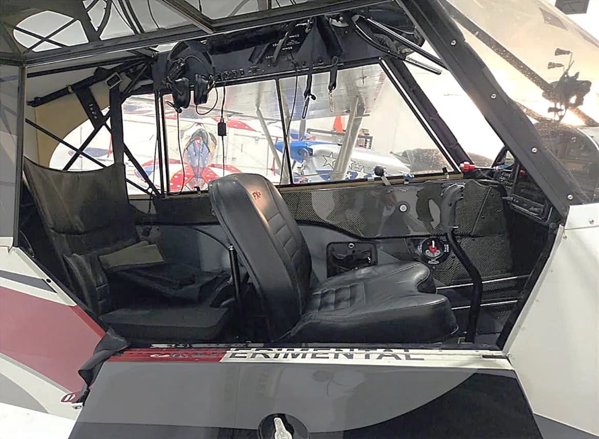 View of the Carbon Cub aircraft's interior, showing the seats and controls.