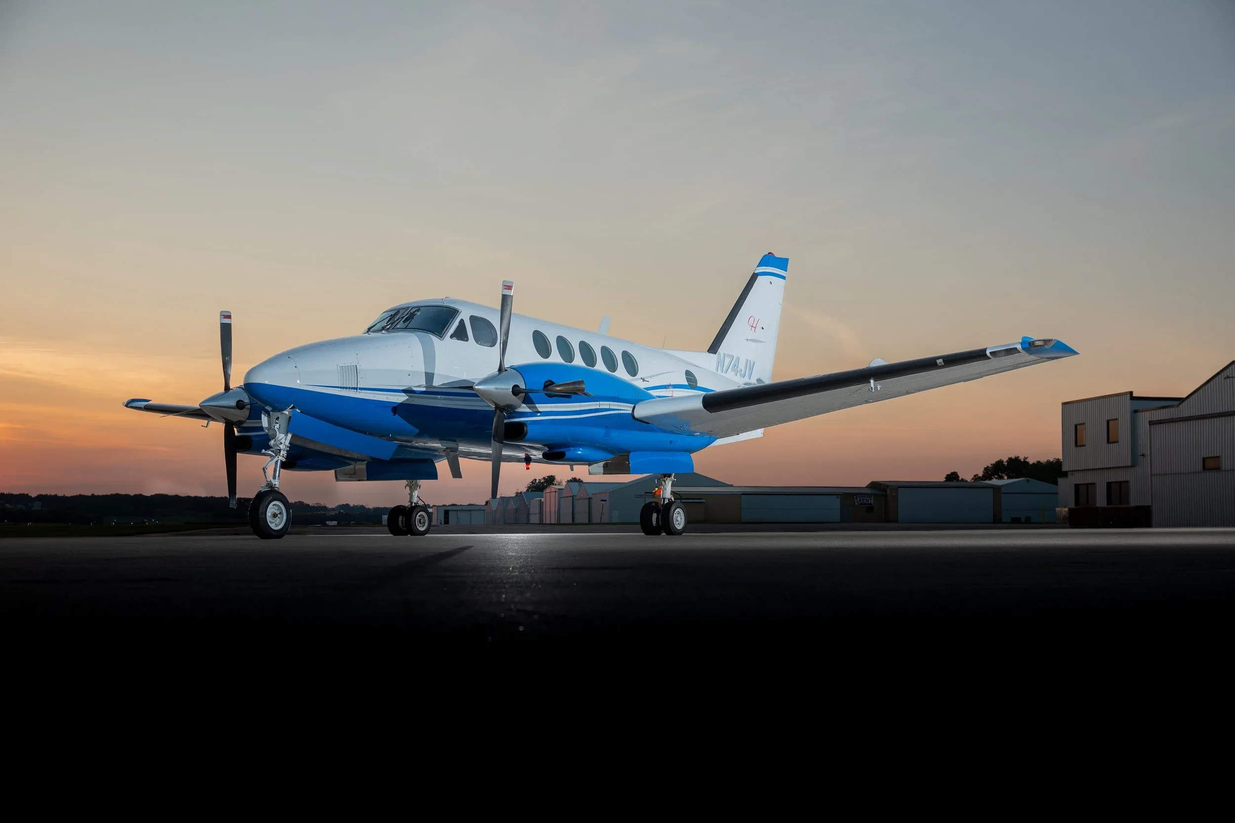 Beechcraft King Air 350i on the tarmac at sunset.