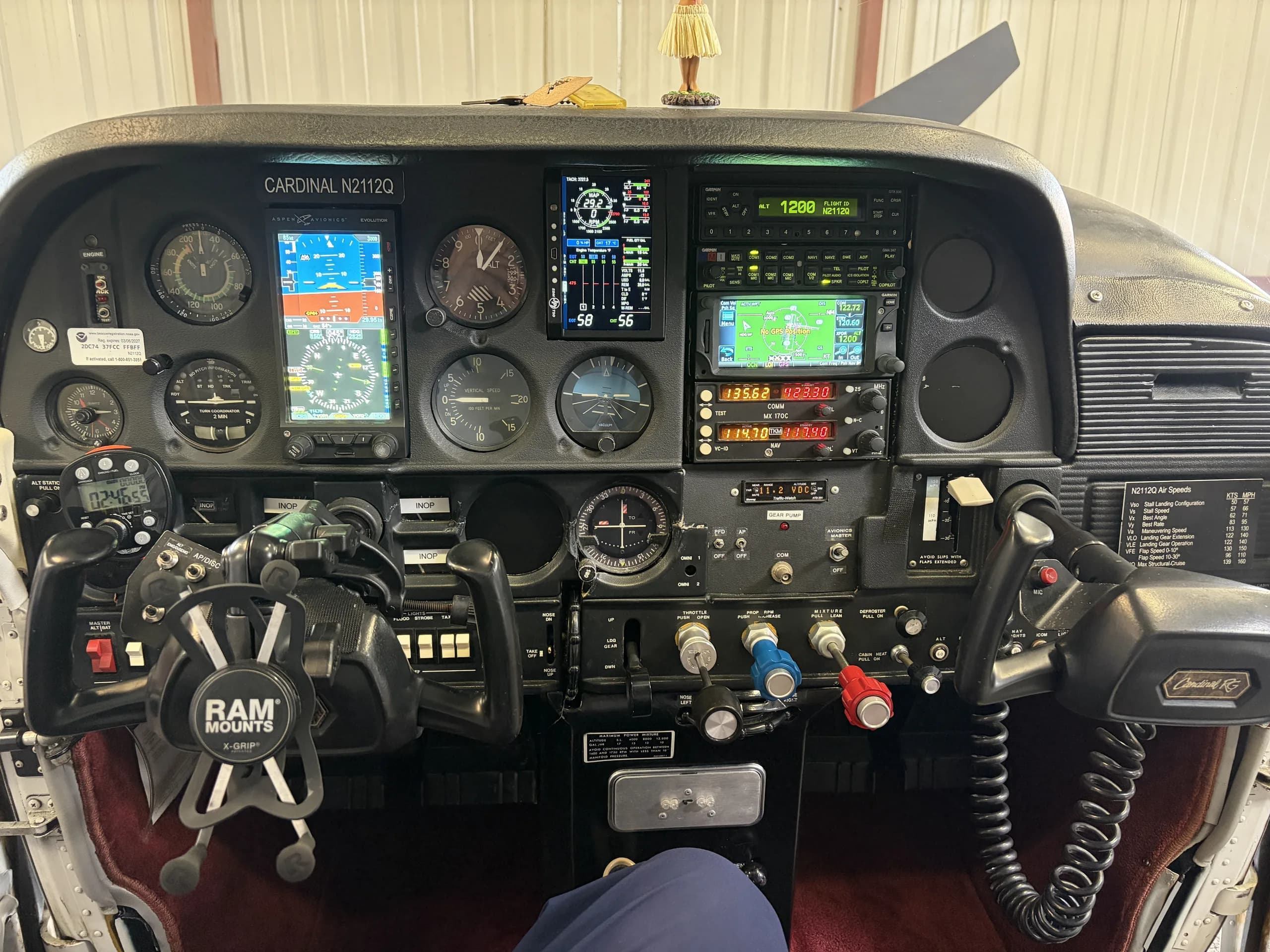 The cockpit of a Cessna Cardinal N2112Q, showing the instrument panel with both analog and digital displays.
