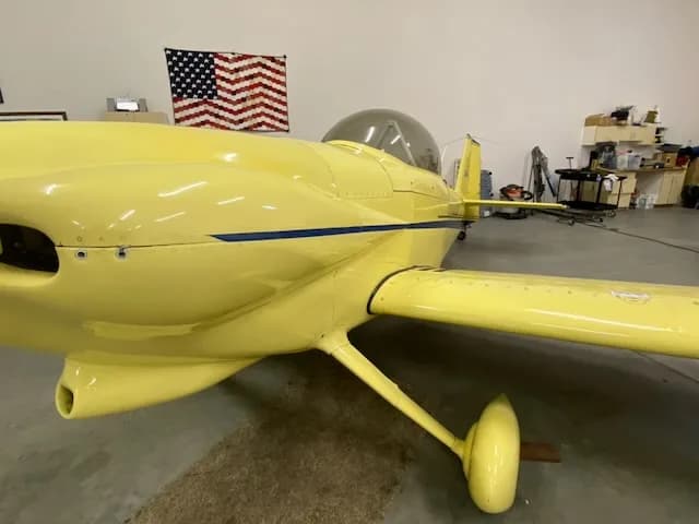 Close-up of the yellow N639TB aircraft in a hangar.