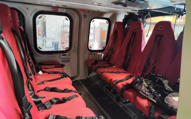 Another angle of the helicopter's interior with red seats.